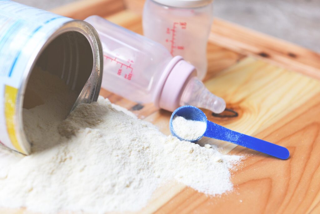 Milk,Powder,Can,With,Spoon,And,Baby,Bottle,Milk,On
